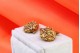 Botões de punho em ouro com rosinhas e decoração esmaltada.